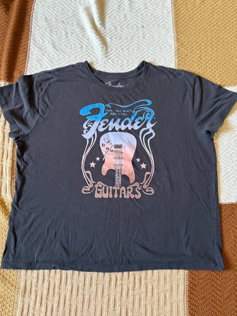 Fender.
Fender Black Tee with Blue and Peach Guitar Graphic. Sz 2X